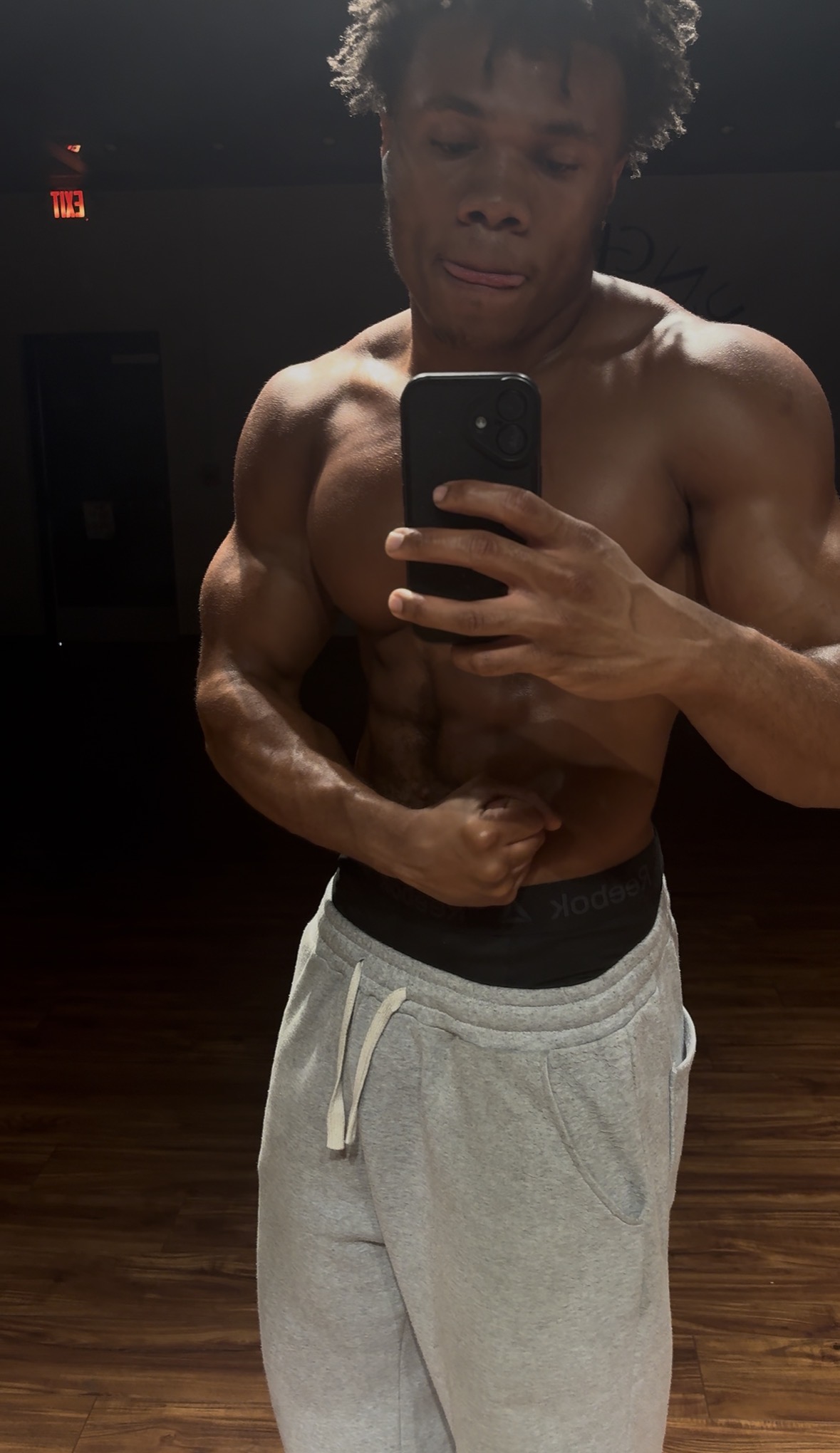 SouljaaJ taking a mirror portrait at the gym